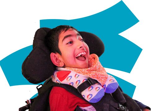 Little boy with big smile on face, colourful background