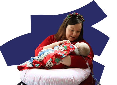 Mum holding baby on coloured background